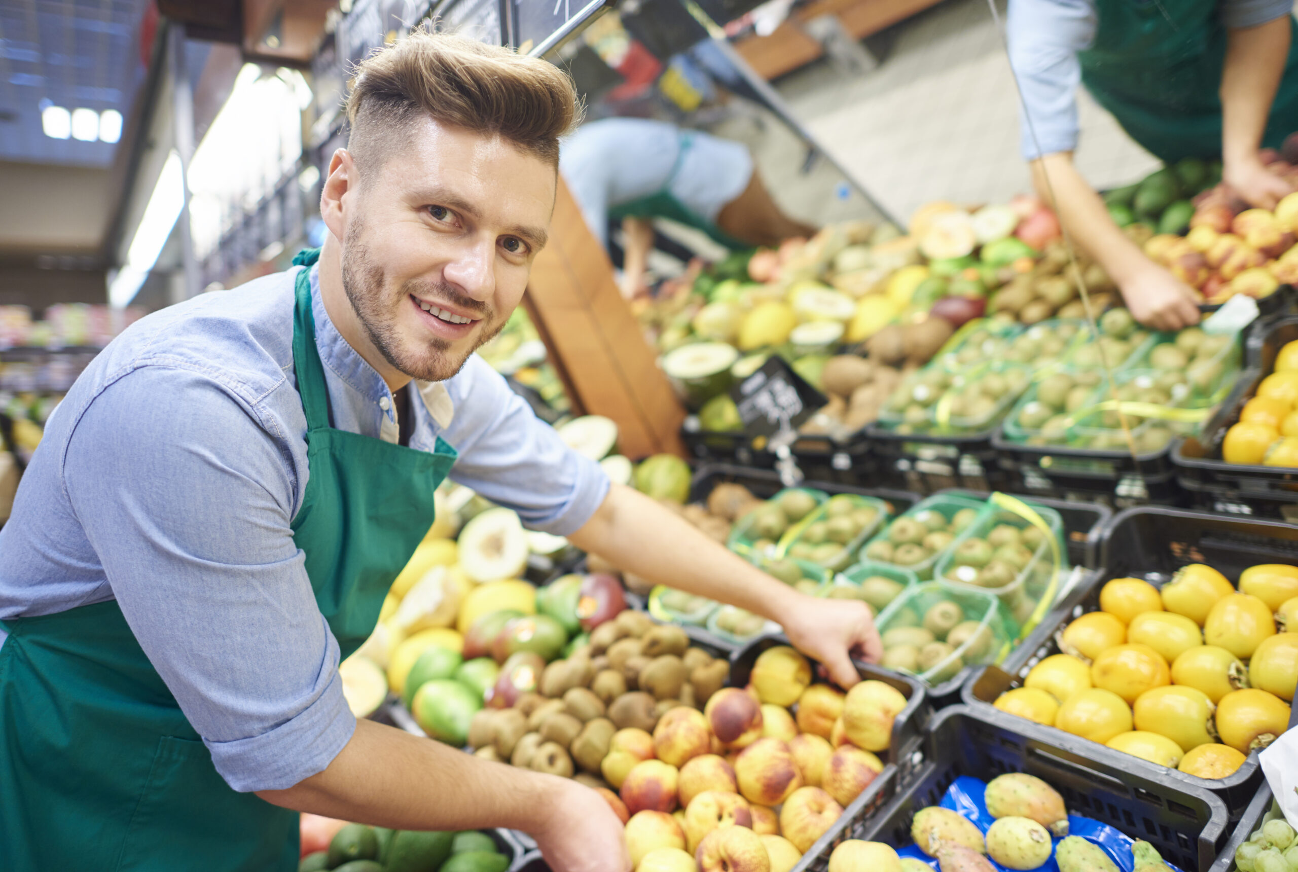 man working hard supermarket scaled Warnbro Grocery Store 8 The Local Safety Bay Grocery Store Supporting Local Farmers